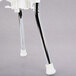 A white metal Ketchup collector with a metal tube.