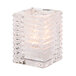 A Hollowick clear glass square candle holder with a light inside.