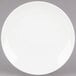 a white plate on a gray background