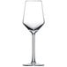 A clear wine glass with a long stem on a white background.