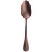 A vintage copper and stainless steel dessert spoon with a brown stem and silver spoon.