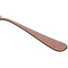 A Sola stainless steel cake fork with a wooden handle.