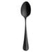 A black spoon with a long handle.