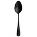 A close up of a Sola vintage black stainless steel dessert spoon with a long handle.