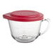 An Anchor Hocking clear glass measuring cup with a red lid.