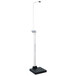 A white Cardinal Detecto electronic clinical scale on a stand with a screen and sonar height rod.