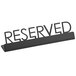 An American Metalcraft black metal tabletop sign with "Reserved" print.