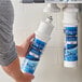 A person holding a C Pure Oceanloch-L2 water filter cartridge.