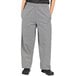 A person wearing Uncommon Chef houndstooth chef pants.