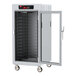 A white holding cabinet with a clear door.