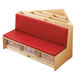 a wooden bench with red cushion