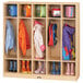 A Jonti-Craft wooden classroom coat locker with several children's coats and bags hanging.