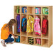 A girl in a yellow shirt and jeans reaching into a Young Time natural wood locker.