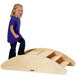 A girl walking on a Jonti-Craft wooden ramp.