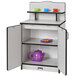 A Rainbow Accents kitchen cupboard with teacups and cups on shelves.