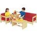 A boy and girl sitting on Jonti-Craft red chairs.