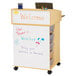 A white Jonti-Craft mobile wood communication center with a whiteboard and storage tubs.