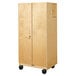 A Jonti-Craft wooden mobile storage cabinet with wheels.