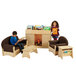 Two children reading books by a Jonti-Craft wood storybook fireplace in a lounge area.