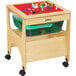 A Jonti-Craft wooden sensory table with green see-thru containers on top.