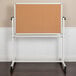 A Flash Furniture reversible cork and white board on a white stand.