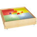 A Jonti-Craft wooden lightbox with colorful blocks on top.