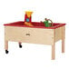 A Jonti-Craft mobile wooden sensory table with toys on wheels.