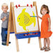 A boy and girl paint a fish on a Jonti-Craft toddler easel.