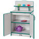 A Rainbow Accents teal kitchen cupboard with teacups and cups inside.