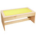 a wooden table with a yellow surface