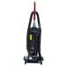 A Sanitaire bagless upright vacuum cleaner with a red handle.