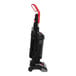 A black and red Sanitaire bagless upright vacuum cleaner on wheels.