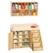 A Jonti-Craft Baltic Birch diaper changing table with shelves and cubbie trays.