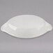 A white oval Hall China au gratin dish.