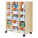 A Jonti-Craft wooden storage unit with several compartments filled with toys.
