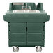 A green Cambro portable hand sink cart with wheels.