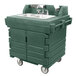 A green Cambro portable hand sink on wheels.