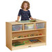 A girl standing behind a Jonti-Craft wood storage cabinet with a green book on it.