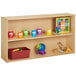 A Young Time natural wooden shelf with toys on it.