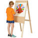 A girl drawing a turkey on a Young Time natural easel.