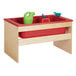 A red and green Young Time laminate sensory table with toys inside.