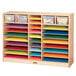A Jonti-Craft wooden mobile paper center with colorful paper and plastic bins on the shelves.