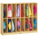 A Jonti-Craft Baltic Birch school locker with bags and backpacks inside.