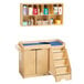 A Jonti-Craft toddler changing cabinet with a shelf and cabinet.