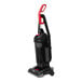A Sanitaire bagless upright vacuum cleaner in black and red with a red handle.
