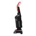 A close-up of a black and red Sanitaire bagless upright vacuum cleaner with a red handle on wheels.