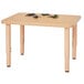 A Jonti-Craft Baltic Birch rectangle table with toys on it.