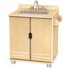 A Jonti-Craft TrueModern wooden play kitchen sink with a faucet.