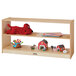 A Jonti-Craft wooden toddler shelf with toys on it.
