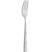 An Amefa stainless steel table fork with a white handle.